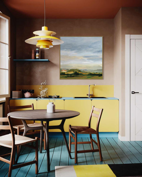 a kitchen with a table, chairs and a painting on the wall