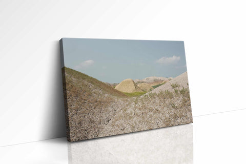a white wall with a picture of a hill in the background
