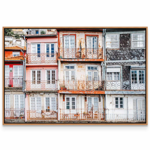 a picture of a building with balconies and shutters