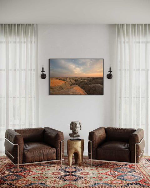 a living room with two chairs and a rug