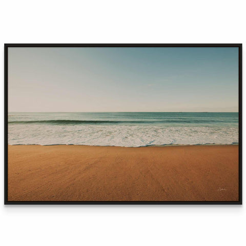 a picture of a beach with the ocean in the background