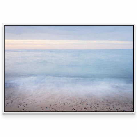 a picture of a beach with the ocean in the background