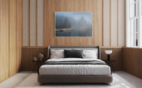 a bedroom with wood paneling and a large bed