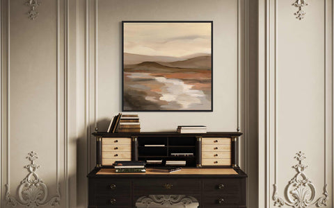 a painting hanging on a wall above a desk