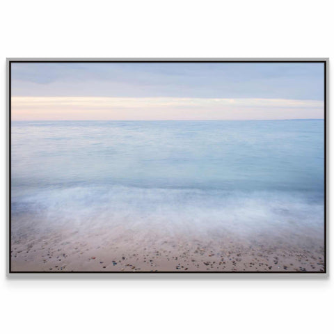 a picture of a beach with the ocean in the background