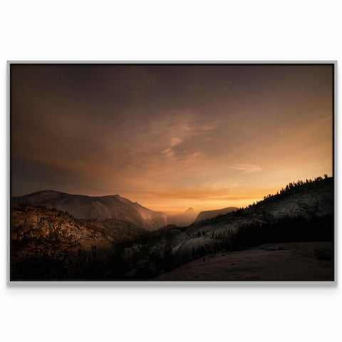 a picture of a sunset over a mountain range