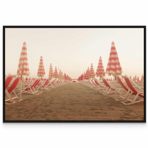 a row of beach chairs sitting on top of a sandy beach