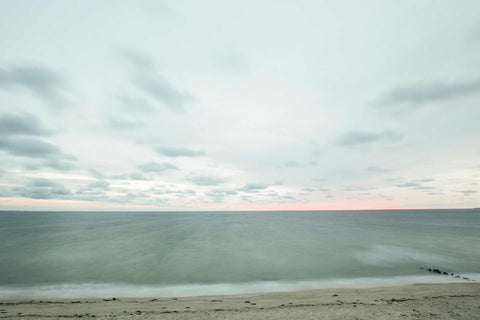 a view of the ocean from the top of a hill