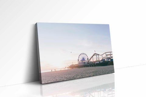 a picture of a ferris wheel on a beach