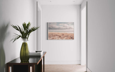 a vase with a plant on a table in a room