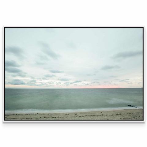 a picture of a beach with the ocean in the background