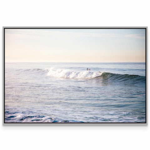 a person riding a wave on top of a surfboard