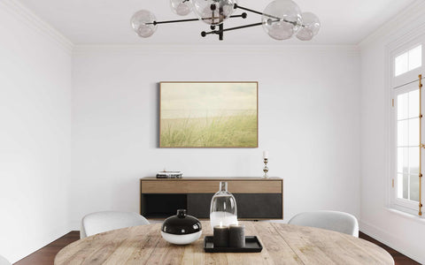 a dining room with a wooden table and white chairs