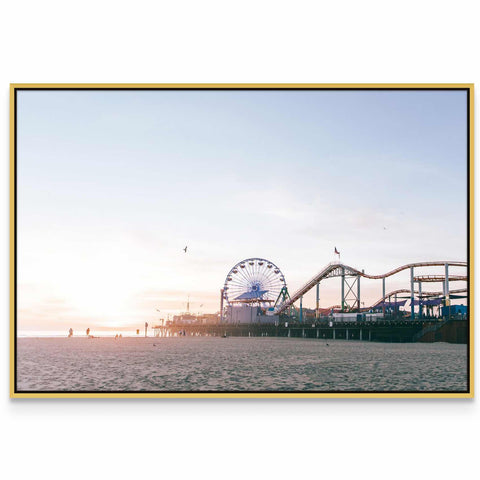 a ferris wheel and a roller coaster on a beach