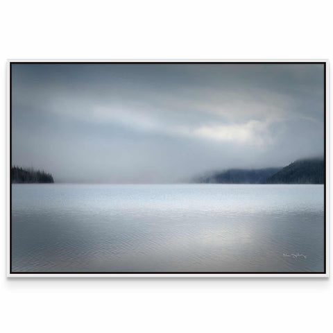 a picture of a lake with a mountain in the background