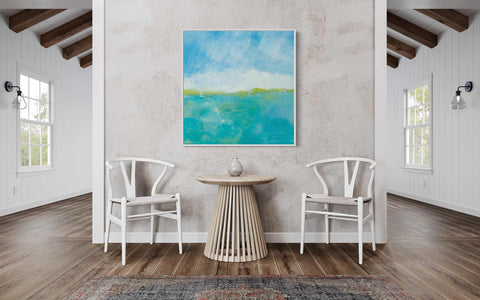 a room with two chairs and a painting on the wall