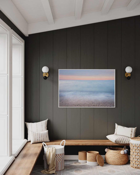 a room with a bench, baskets and a painting on the wall