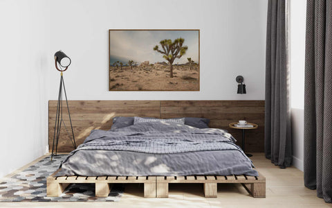 a bedroom with a bed made out of wooden pallets