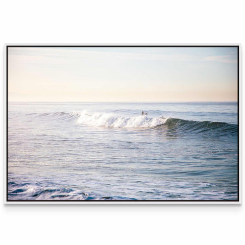 a person riding a wave on top of a surfboard