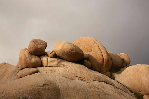 a group of rocks sitting on top of a large rock