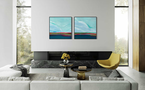 a living room with two paintings on the wall