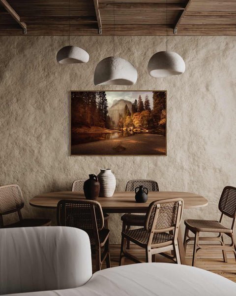 a room with a table, chairs and a painting on the wall