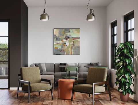 a living room filled with furniture and a painting on the wall