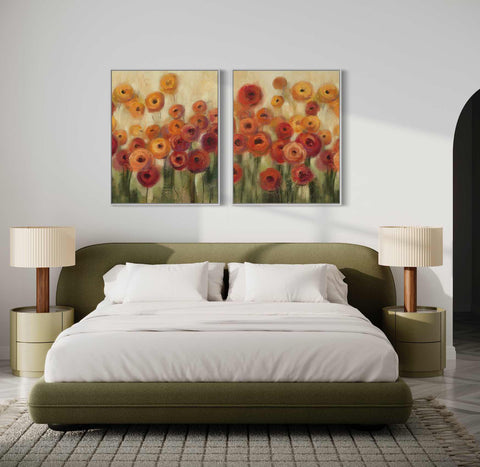 a bedroom with a bed and two paintings on the wall