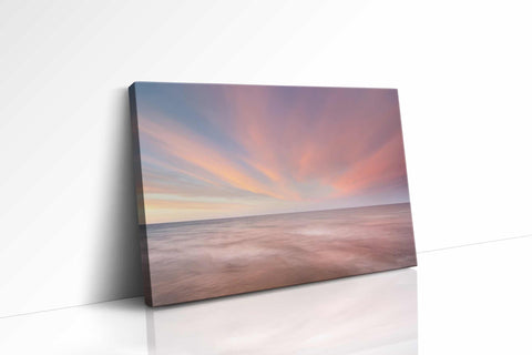 a painting of a sunset over the ocean