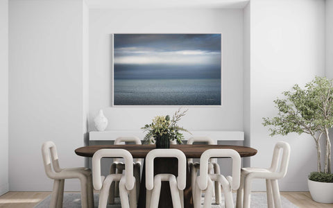 a picture of a dining room with a table and chairs