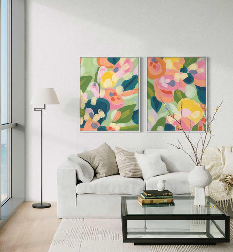 a living room with two paintings on the wall
