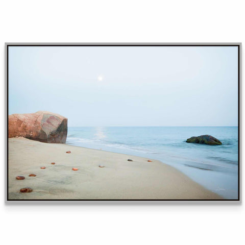 a picture of a beach with rocks and water