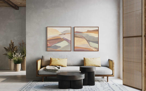 a living room with two paintings on the wall