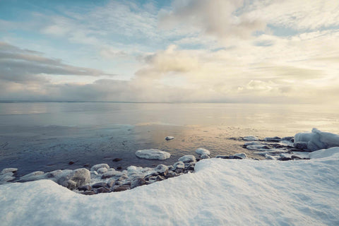 a view of a body of water covered in snow