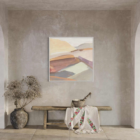 a painting hanging on a wall next to a wooden bench