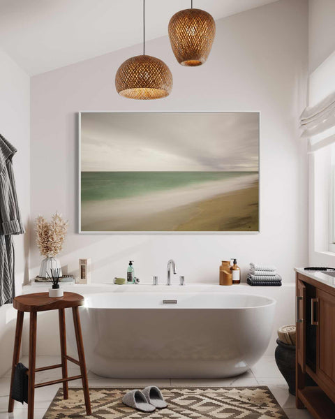 a bathroom with a large bathtub and a painting on the wall