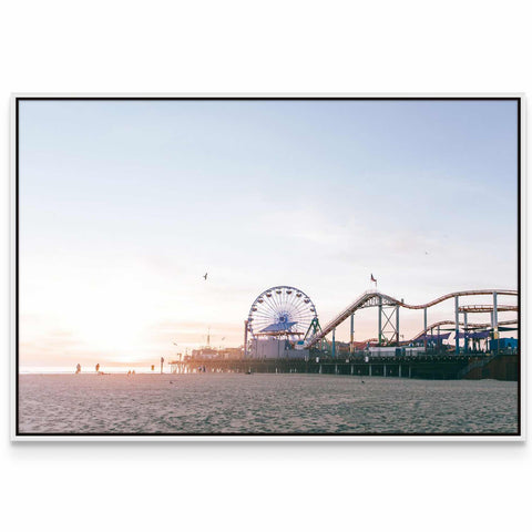 a ferris wheel and a roller coaster on a beach