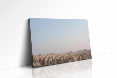 a white wall with a picture of a mountain range