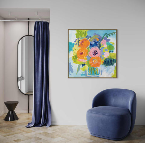 a blue chair in a room with a painting on the wall