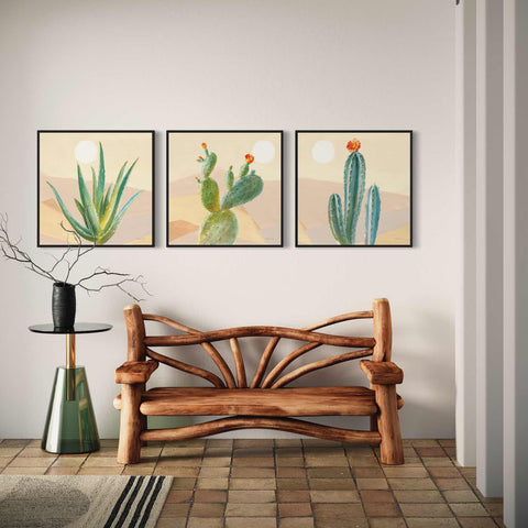 a wooden bench sitting in front of two paintings