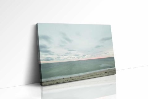 a white wall with a picture of a beach
