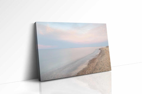 a white wall with a picture of a beach on it