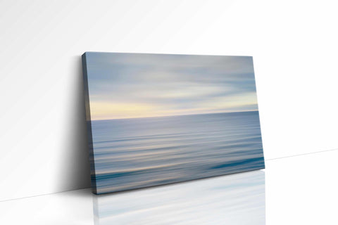 a picture of the ocean on a white wall