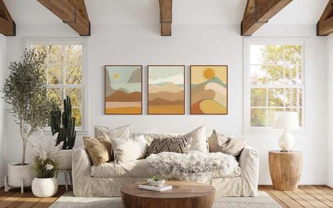 a living room filled with furniture and a painting on the wall