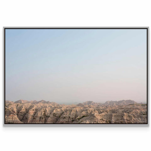 a picture of a mountain range with a sky background
