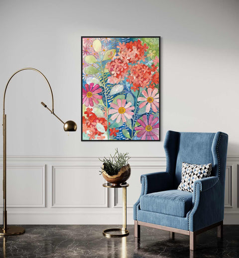 a living room with a blue chair and a painting on the wall