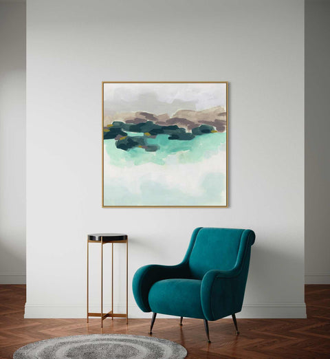a chair in a room with a painting on the wall