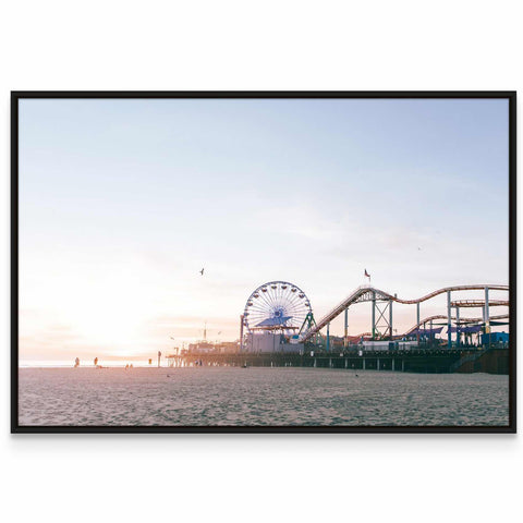 a ferris wheel and a roller coaster on a beach