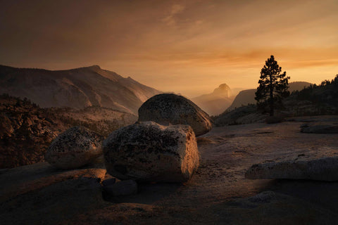 a couple of large rocks sitting on top of a mountain