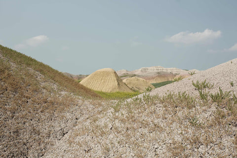 a group of hills that are covered in grass